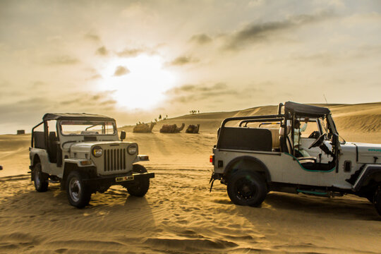 Safari jeeps on the Sam Sand Dunes