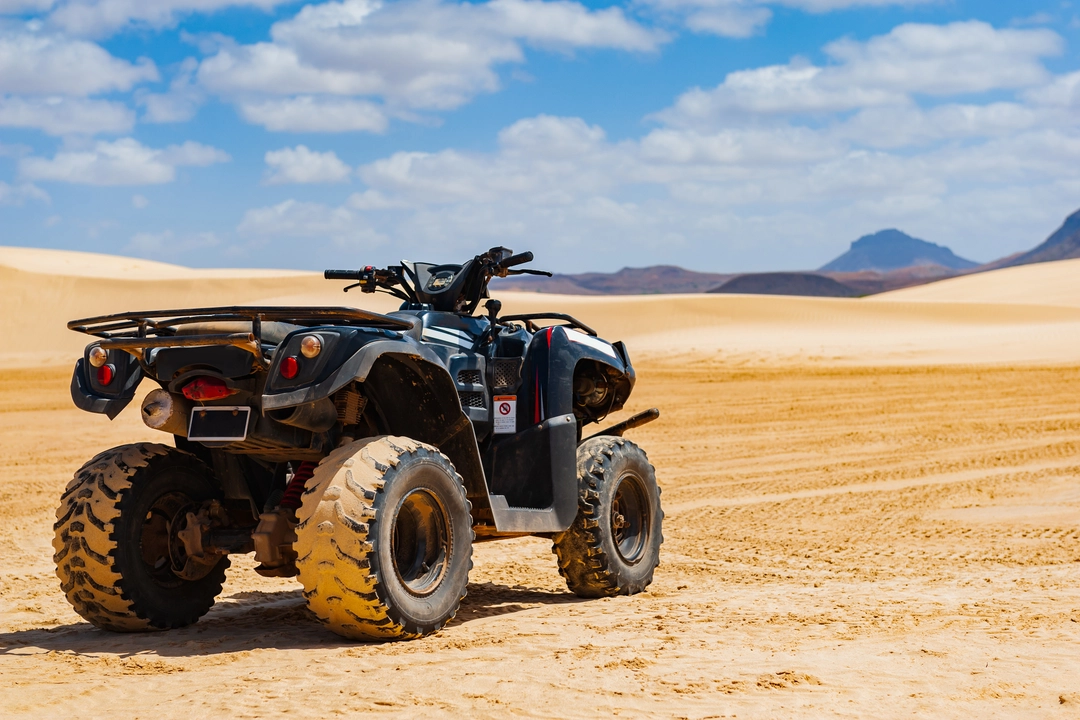 Quad bike on open sand dunes